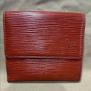 Louis Vuitton Epi leather in Cognac brown.